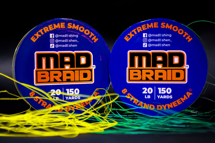 Two spools of Mad Braid braided fishing line in blue packaging, highlighting extreme smoothness and high-performance Dyneema fiber construction.